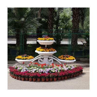 China Modern Type Multi-Layer Outdoor Wrought Iron Wheel Floor Stand Flower Plant Stand Flower Pot Rack Flower Pot Shelf for sale