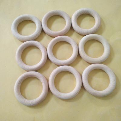 China Baby Toy Natural Round Beech Wood Teether Soft Wood Rattle Bracelet DIY Wooden Rings for sale