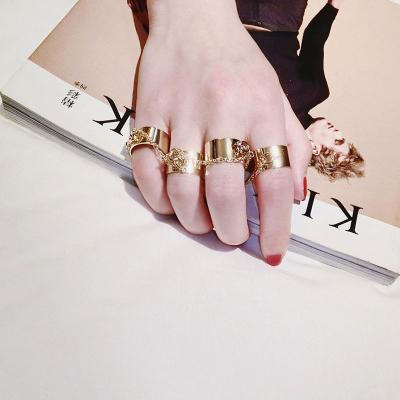 China Hip Hop Luge Hip Hop Rings Black And Rose Gold Plated Hip Hop Ring Stack Rings Golden With Personality Trend Gun Chain for sale