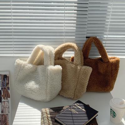 China 2022 New Portable Spring Motion Sensing Bag Design Plush Fashion Single Spring Lambswool Bag Clutch for sale