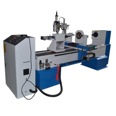 China CNC wood lathe machine with engraving spindle for sale