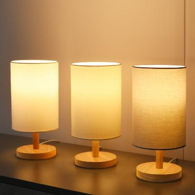 China Table Lamp ODM Small Desk Minimalist Small Fabric Lamp Natural Simple Translucent Solid Wood Shade Base For Bedroom for sale