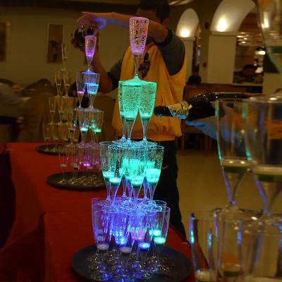 China Liquid Activated Glowing Inductive Flashing Light Custom Party Barware LED Event Light Up Glow Dark Promotional Disposable Plastic Cup Champagne Flutes for sale