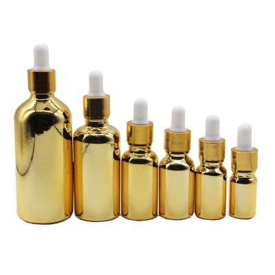 China Personal Care 25ml 1oz Dropper Bottle Skin Gold Clear Custom Shape Series Cosmetic Packaging Sets Glass Bottle for sale