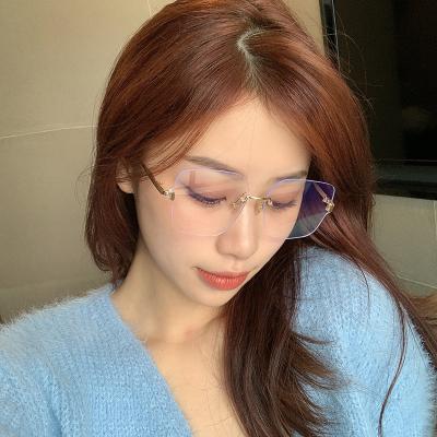 China Newest Simple Creative Blue Light Blocking Rimless Cut-Edge Rimless Anti-Blue Light Glasses Frame Flat Mirror For Women for sale