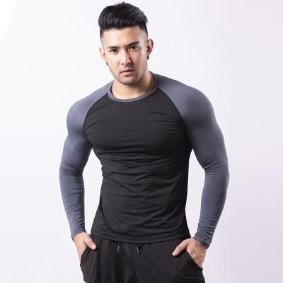 China Breathable Workout Clothes Gym Well-Fitting Men's Sports Quick-Drying T-shirt Basketball Men's Wear Long Sleeve Fitness Tee for sale