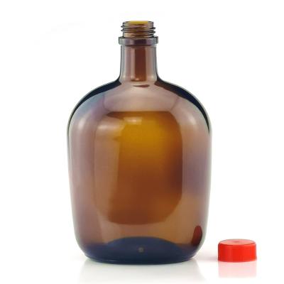 China 2019 Hot Selling Wine 700ml Wine Bottle Round Glass Flip Cap Glass Bottle for sale