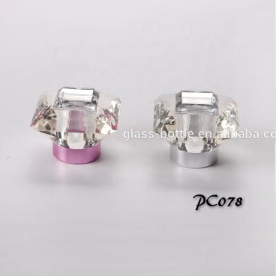 China Non Refillable Acrylic Material Diamond Shape Clear Perfume Oval Cap With Metal Patch On Top for sale