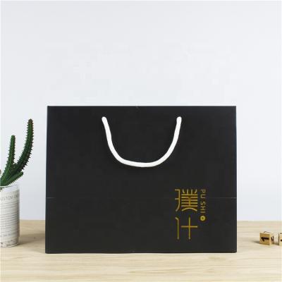 China Recyclable Wholesale Custom Logo Brand Luxury Bags Gold Foil Kraft Paper Bag With Ribbon Handle for sale