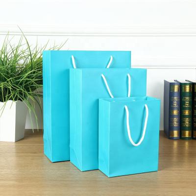 China Recyclable Custom Printed Gift Cardboard Bags Recycle Using Paper Package Gift Bags With Logo for sale