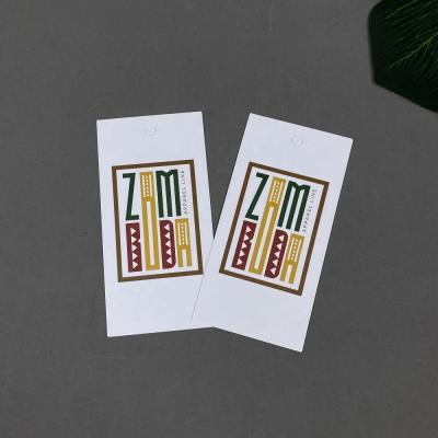 China Viable Custom Printed Colorful Logo Clothing Hang Tag Garment Accessories Paper Hang Tags for sale