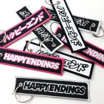 China Custom High Quality Custom Jettag Embroidered Apparel Logo Woven Fabric Key Chain for sale