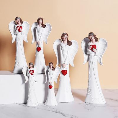 China Europe Holding Red Love White Angel Ornaments Resin Craft Bundle Religious Resin Craft Angel Wing Angel Statues Resin Crafts for sale