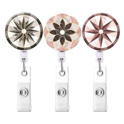 China Durable ABS Glue Patch Creative Geometric Octagonal Star Plastic Badge Reel Holder Clip for sale