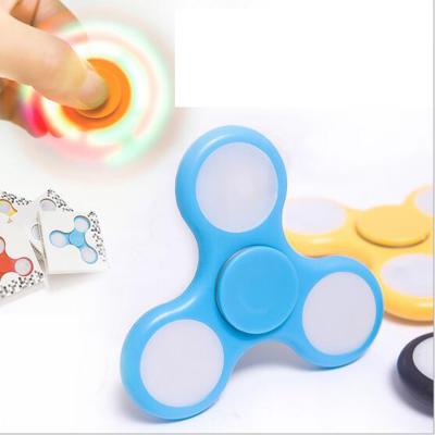 China Mini Toy Custom Logo Printed LED Moving Person Spinner for sale