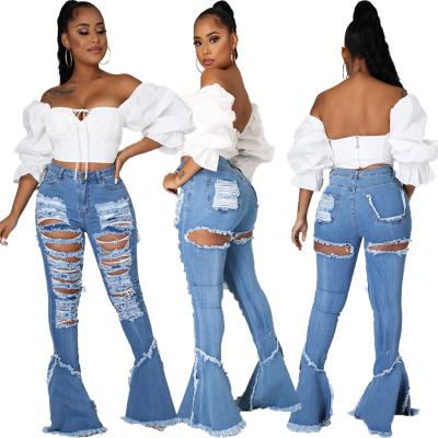 China Breathable All Matching Woman Fitted Big Tassel Hole Slim Jeans Flared Bottom Denim Pants Jeans for sale