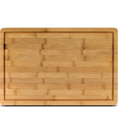 China Sustainable Extra Large Bamboo Thicken Cutting Board With Groove For Cheese Meat Food for sale