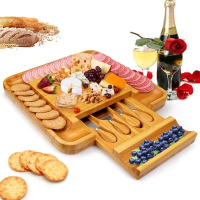 China Disposable bamboo cheese board set with cutlery in slide-out drawer - including 4 stainless steel serving utensils for sale