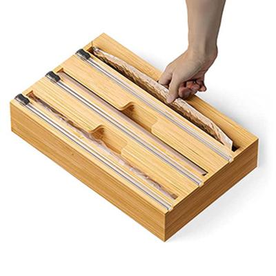 China Modern Compatible 3 in 1 Kitchen Drawer Organizer Bamboo Roll Plastic Wrap Aluminum Foil Wax Paper Storage Dispenser with Slide Cutter for sale