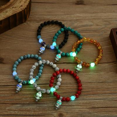 China High quality/factory source elastic beaded bracelets Halloween bead bracelet natural round volcanic luminous stone luminous skull bracelet for sale