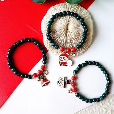 China Cute High Quality/Factory Sourced Santa Claus Pendant String Green Ceramic Beaded Bracelet Jewelry Christmas Bracelet for sale