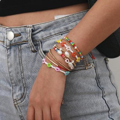 China Hot Selling Bohemia Style Cute Multi Colored Stackable Beads Chain Flower Shaped Retro Women Bracelet Set For Beach for sale