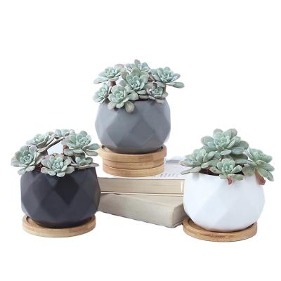 China wholesale Creative Ceramic Succulent White Simple Minimalist Black White Indoor Floor Design Face Flowerpot Pot Potting for sale