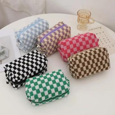 China 2023 fashion checkerboard style cosmetic bag weave zipper simply sweeps travel makeup storage bag pencil wash bag for women girls for sale