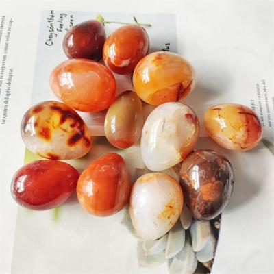 China Europe Natural quartz stone egg crystals Healing stones crafts red carnelian palm stone for sale