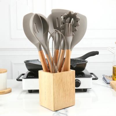 China Home Kitchen Cooking Utensils Set Heat Resistant Silicone Cookware Cooking Tools Wooden Handle Spoon Kitchen Utensil Set With Stand for sale