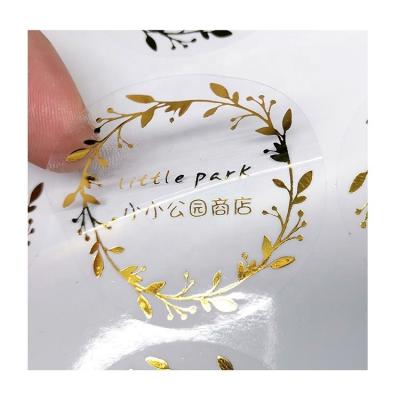 China Custom Sticker Logo Gold Foil Die Cut Sticker Matte Glossy Sticker Paper Transparent High Quality Waterproof Packaging Label for sale