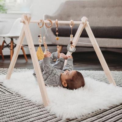 China Eco-friendly.anti-slip.water-proof XIHA Baby Gymnasium Eco-friendly Beech Wooden Play Gym Frame Activity Center Mat With Teething Rattle Toy baby inside for sale