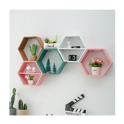 China Contemporary Home Bedroom Hexagonal Multi-Layer Wooden Shelf Wall Hanging Living Room Shelf Decoration Free Punch for sale