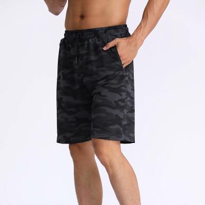 China Anti-Wrinkle Men's Summer Shorts Camouflage Printed Elastic Waist Drawstring Fitness Sports Shorts for sale