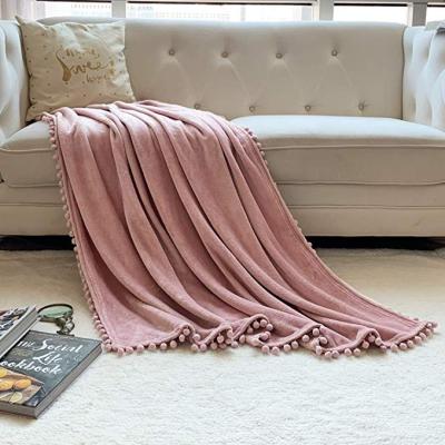 China Anti-pilling Throw Blanket Flannel Blanket With Decorative Pompom Fringe Lightweight Soft Tassels Blanket For Indoor Outdoor for sale