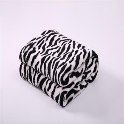 China Super Soft Animal Print Polyester Anti-pilling Fleece Blanket Faux Zebra Pattern Faux Fur Coral Blanket for sale