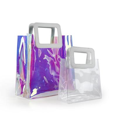 China Custom Fashion Laser Handled Portable Colorful Transparent PVC Shopping Bag for sale