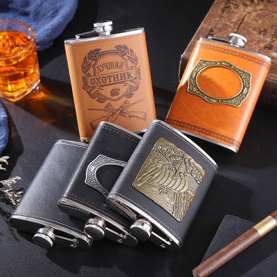 China Art Decor Portable Luxury Custom Logo Whiskey Hip Steel Flasks Leather Cover Metal Stainless for sale