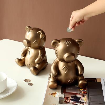 China Art Home Decor Resin Opens Indoor Living Room Decoration Article Home Bear Shape Piggy Bank Modern Kid Child Toy Piggy Bank for sale