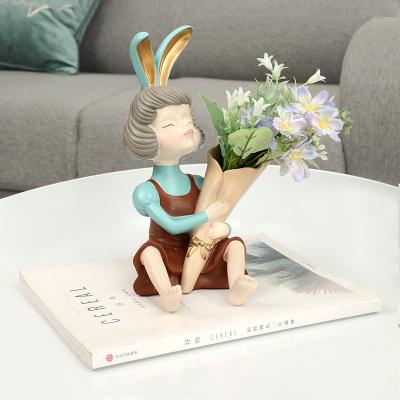 China Creative Northern Europe 24CM resin bouquet rabbit girl statue vase flower arrangement dried flowers artist home decoration gift for sale