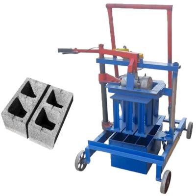 China Construction worksÂ   Small Mobile Manual Vibrating Hollow Soil Cement Laying Concrete Block Brick Making Machine Price for sale