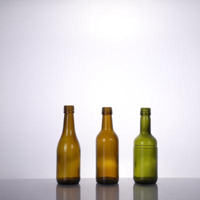 China Wholesale High Quality 750ml Empty Beverage Colored Round Liquor Bottle Glass Wine Bottle for sale