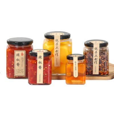 Chine Le pot en verre transparent de confiture scellé met en boîte des couvercles avec un revêtement de plastisol adapté aux besoins du client à vendre