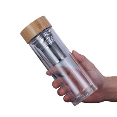 China Kundengebundene Borosilicat-Glasflasche, Klarglas-Trinkflasche mit Bambusdeckel zu verkaufen