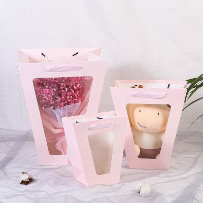 China New Valentine's Day Recyclable Clear Trapezoidal Net Red Window Gift Paper Flower Bouquet Hand Held Bags for sale