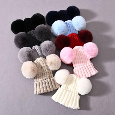 China Hign COMMON Soft Material Quality Wholesale Unisex Winter Kids Pompom Beanies Lovely for sale