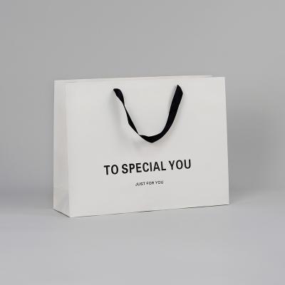 China Wholesale custom luxury brand retail brand clothing jewelry shopping gift packaging paper bag with logo for sale