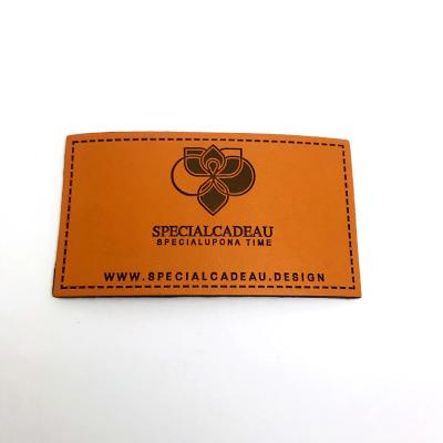 China Viable Fashion Brand Logo Leather Light Brown Embossed Label Smooth Surface Leather Patches For Bags for sale