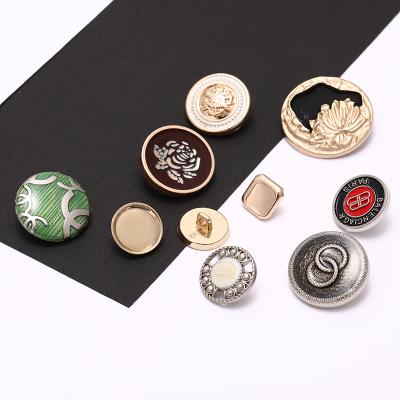 China Custom Viable Logo Gold Embossed Dome Shirt Metal Sewing Leg Buttons For Clothing for sale