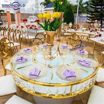 China Popular modern elegant golden round stainless steel wedding cake table for event banquet dining table for sale